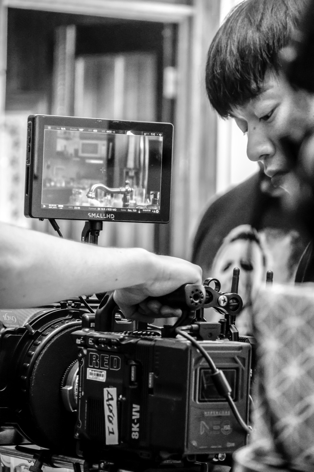 Sung Ju Hur preparing a cinema camera on set